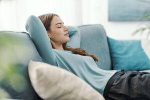 Person relaxing during hypnotherapy for chronic pain